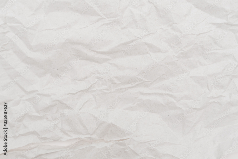 Obraz premium White crumpled paper texture background. Close-up.