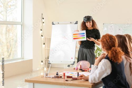 Young woman teaching studen...