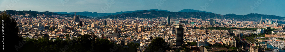Panoramic view of Barcelona city, port and mountains. Spain