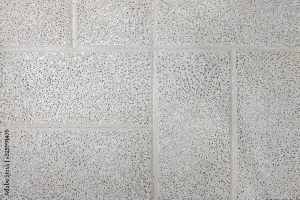 Fototapeta premium Tile with stone chips, close-up background