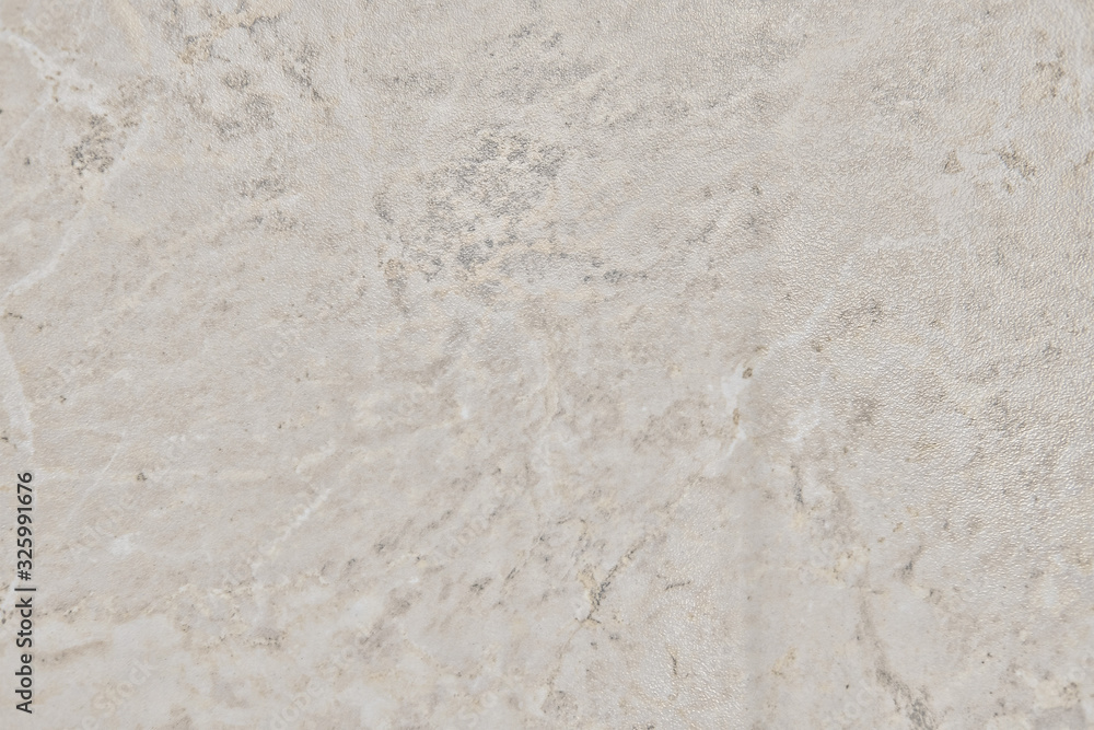 Texture of shiny beige stone, close-up background Texture of shiny beige stone, close-up background