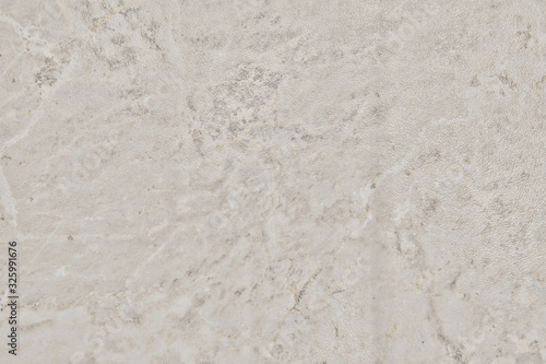 Texture of shiny beige stone, close-up background
