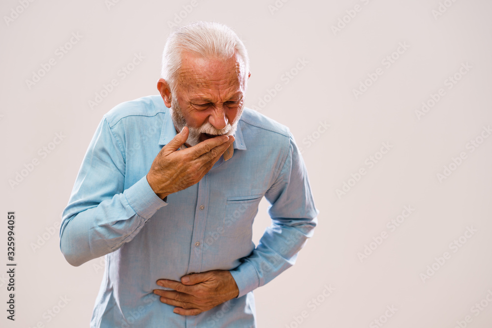 Portrait of senior man who is having pain in stomach. Portrait of senior man who is having pain in stomach.