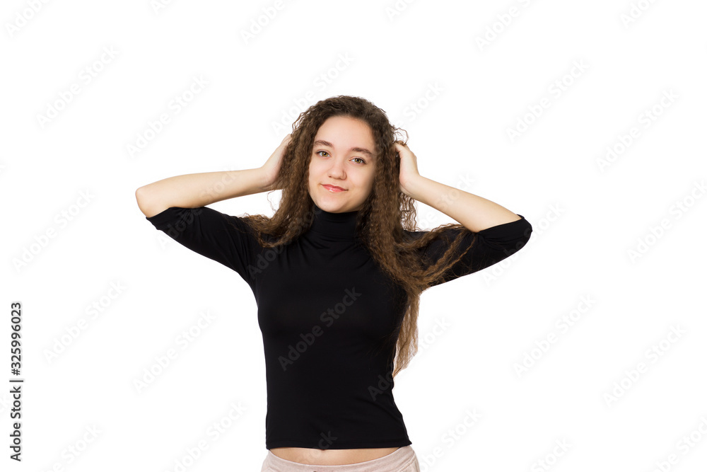 Cute teenager girl with long curly hair, on a white background Cute teenager girl with long curly hair, on a white background