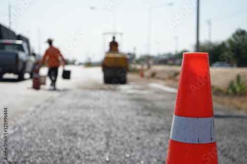 Red rubber cone in road construction And background blur