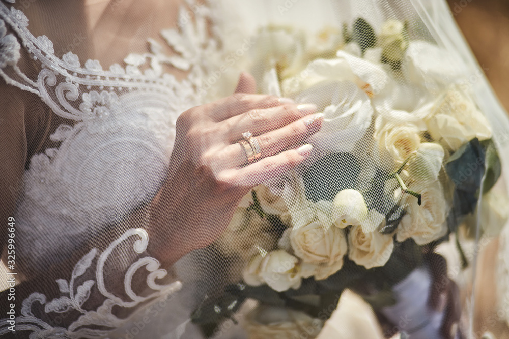 bouquet in hands of the bride, woman getting ready before wedding ceremony bouquet in hands of the bride, woman getting ready before wedding ceremony