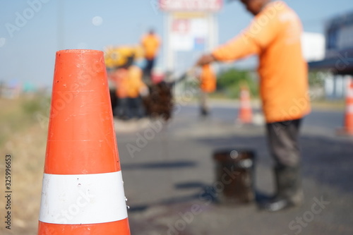 Red rubber cone in road construction And background blur