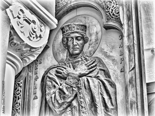 Statue of Christian saint woman on the church door