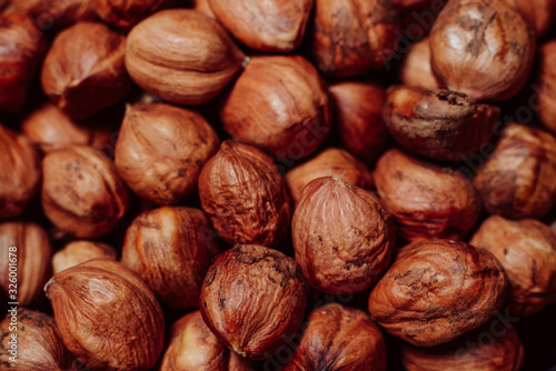 Purified hazelnuts on market counter in daylight. Fresh nuts in macro photo. Close up. Top view.