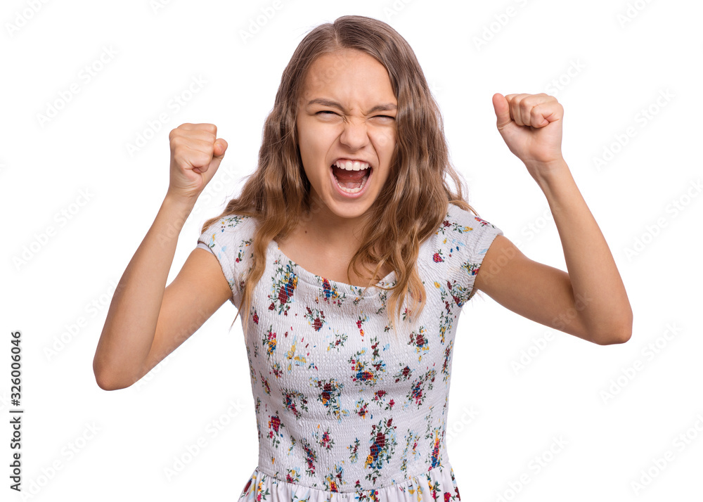 Angry teen girl, isolated on white background. Child looking at camera in amazement, clenching fists. Hate and rage - caucasian teenager, opening mouth, screaming. Negative and evil facial expression Angry teen girl, isolated on white background. Child looking at camera in amazement, clenching fists. Hate and rage - caucasian teenager, opening mouth, screaming. Negative and evil facial expression