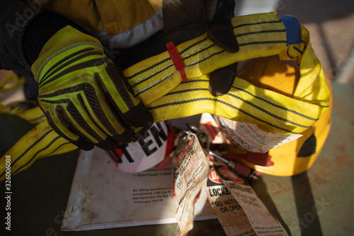 Photography Top view of rigger inspector high risk worker hand wearing heavy duty glove hold