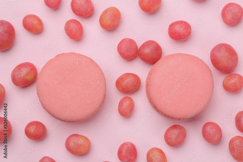 The concept of minimalism. pasta cake and delicious bright pink sweets on a bright pink background. top view The concept of minimalism. pasta cake and delicious bright pink sweets on a bright pink background. top view