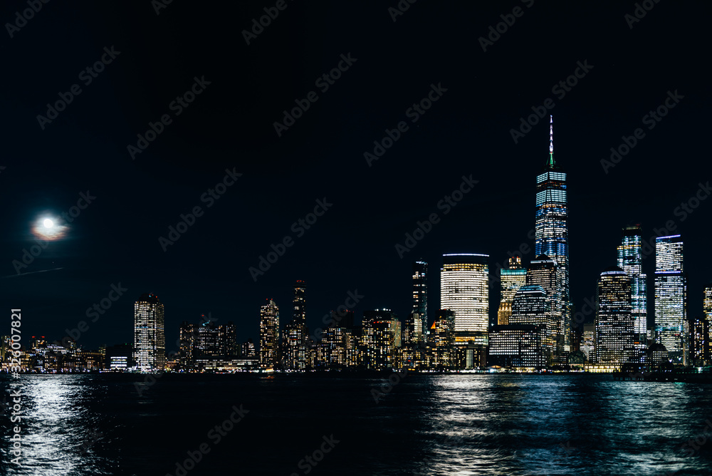 Amazing panorama view on New York City skyline and Downtown Manhattan from Jersey City during night and Full Moon