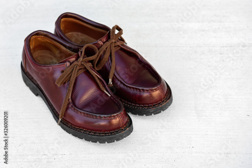We maintained burgundy leather boots.