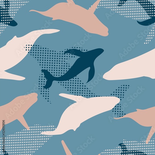 seamless pattern of colorful blue whales with diver and dots in light blue background. Kids cloths, background, pattern, design, fabric.