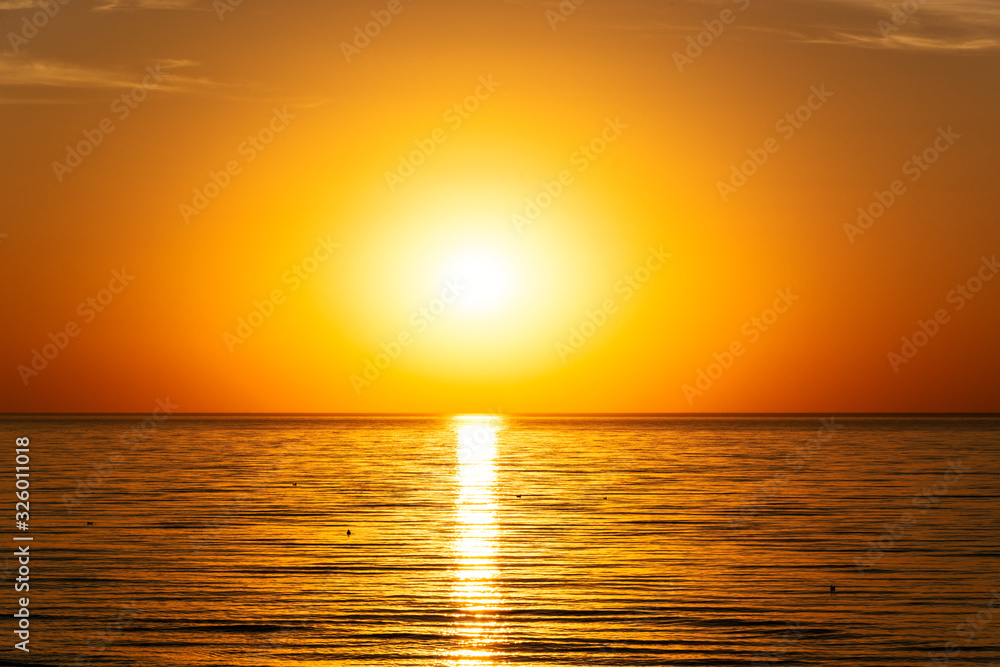 beautifun sunset on the beach with calm sea beautifun sunset on the beach with calm sea