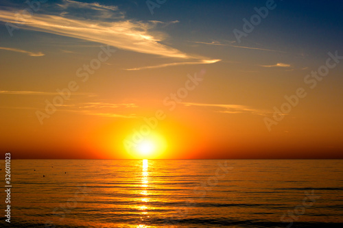 beautifun sunset on the beach with calm sea © WeźTylkoSpójrz