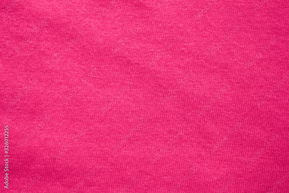 Fototapeta premium Pink fabric texture background, soft cotton cloth backdrop. Blank pink fabric pattern, smooth seamless cloth wallpaper, plain colorful shirt element