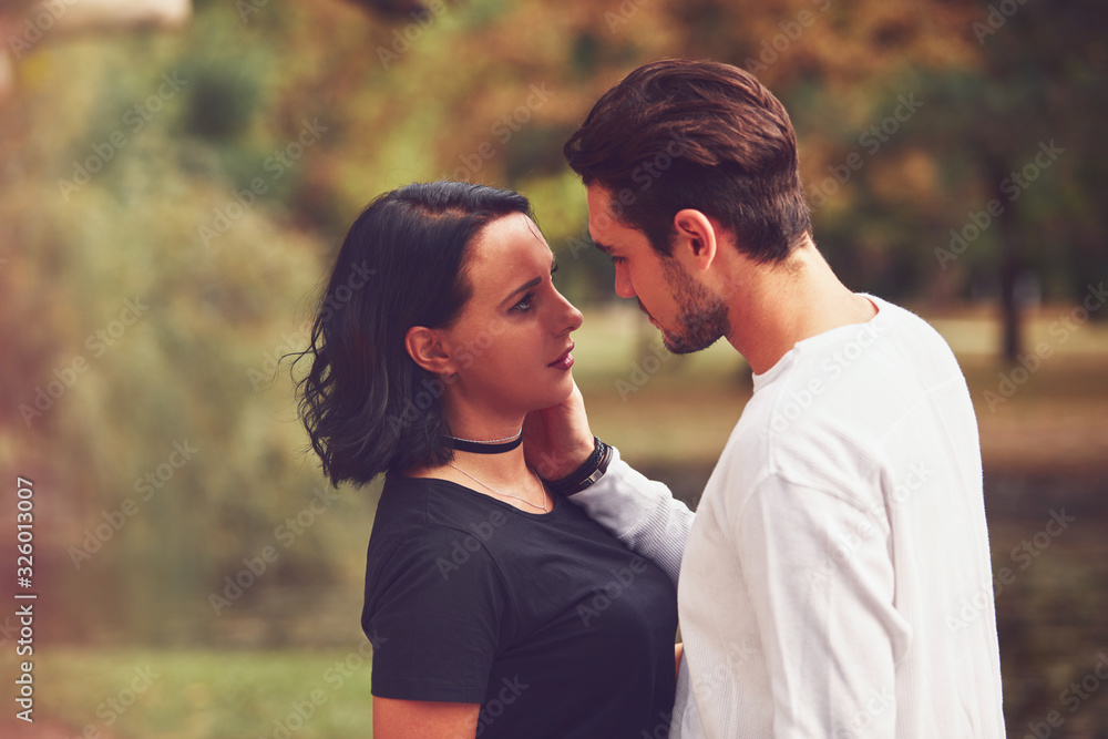 Couple in love hugging and kissing outdoors. Love concept. Couple in love hugging and kissing outdoors. Love concept.