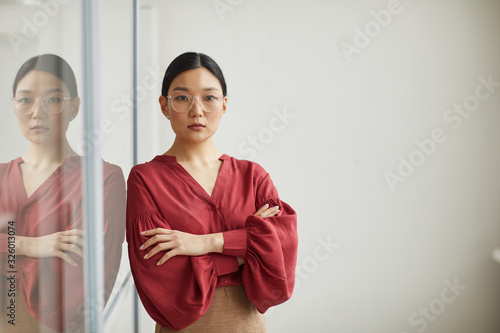 Принти на полотні Waist up portrait of successful Asian businesswoman posing confidently standing