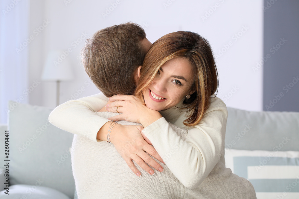 Portrait of beautiful couple at home