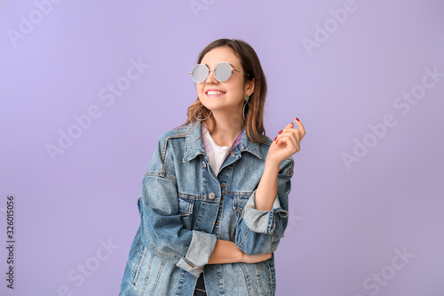 Young woman with stylish su...