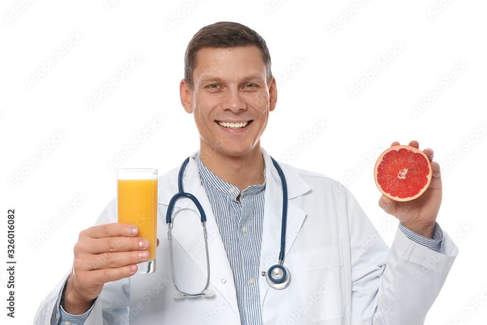 Nutritionist with glass of juice and grapefruit on white background Nutritionist with glass of juice and grapefruit on white background