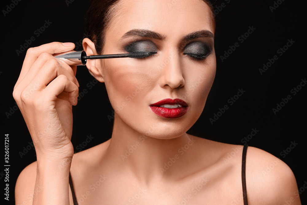 custom made wallpaper toronto digitalBeautiful young woman applying makeup against dark background