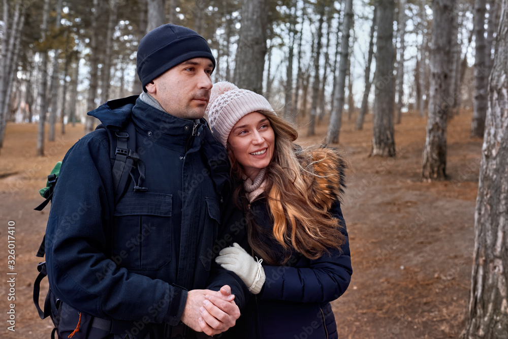 A couple in late winter forest A couple in late winter forest
