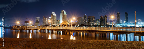 Night downtown cityscape with pier on foreground