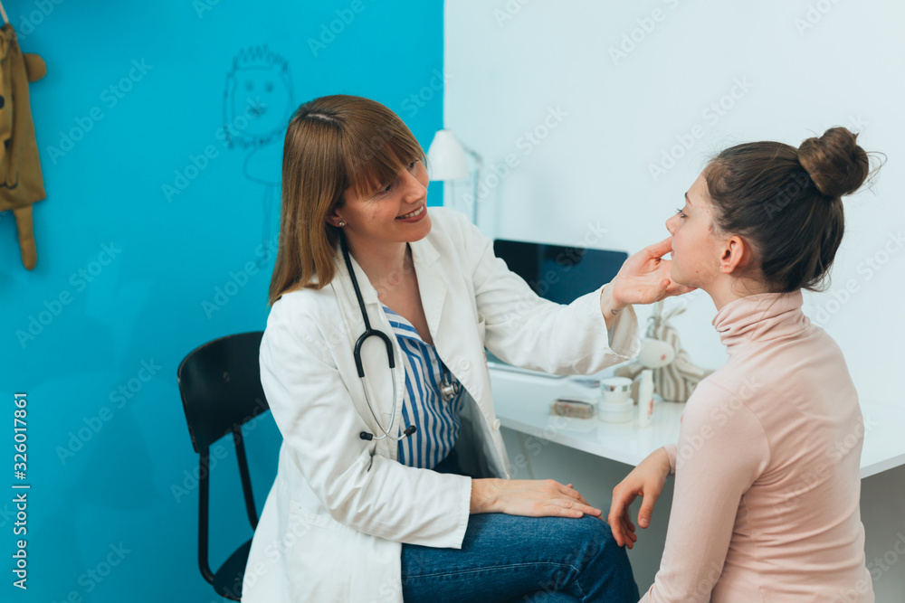 teenager girl at the dermatologist doctor teenager girl at the dermatologist doctor