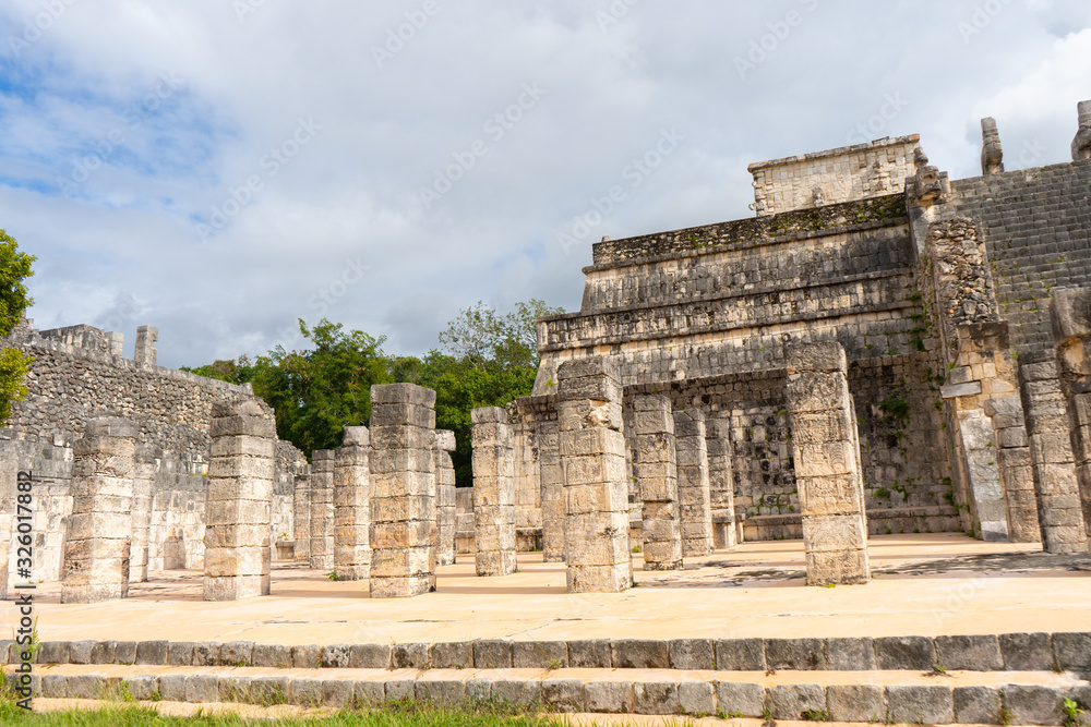 Fototapeta premium The Temple of the Warriors (Templo de los Guerreros) complex. Chichen Itza archaeological site. Architecture of ancient maya civilization. Travel photo or wallpaper. Yucatan. Mexico.