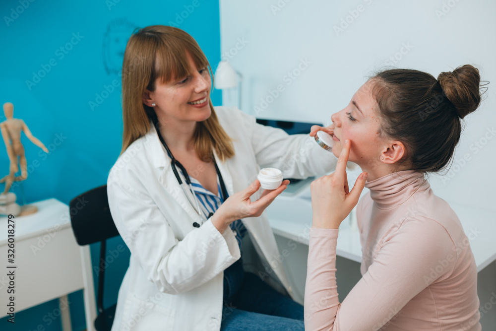 teenager girl at the dermatologist doctor teenager girl at the dermatologist doctor