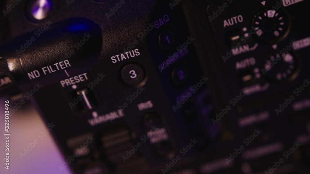 Close up of the side of a professional cinema camera body with buttons Close up of the side of a professional cinema camera body with buttons