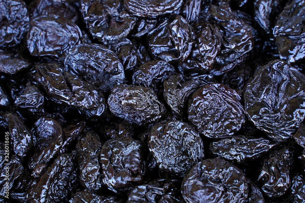 Background of delicious dried plums (prunes). Texture of food. Close up. Background of delicious dried plums (prunes). Texture of food. Close up.