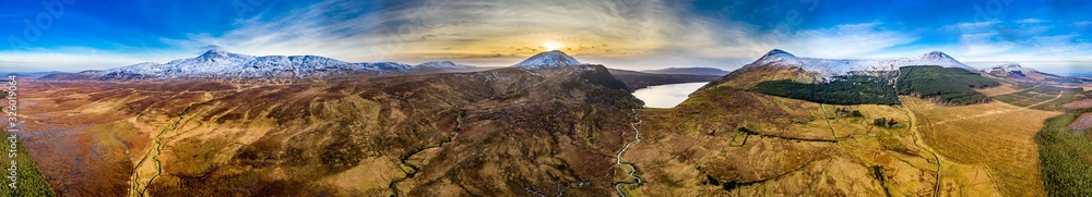 Aerial view of Mount Errigal, the highest mountain in Donegal, seen from South East with Aghla More and Aghla Beg and Derryveagh Mountains - Ireland
