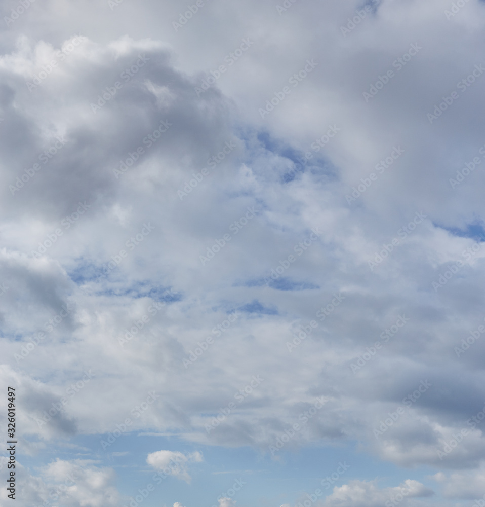 White cumulus clouds on a blue sky. Beautiful natural abstract background. Concept of forecast and meteorology White cumulus clouds on a blue sky. Beautiful natural abstract background. Concept of forecast and meteorology