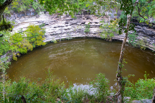 Sacred Cenote. Chichen Itza archaeological site. Ancient maya civilization. Travel photo or wallpaper. Yucatan. Mexico. photo