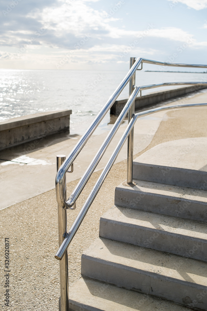 Metal railings and glass wall outdoor near sea Metal railings and glass wall outdoor near sea