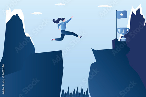 Businesswoman jumping over between the cliffs.Jump over an obstacle. Business risk, victory and success