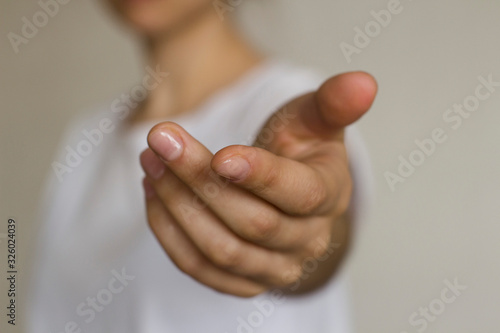 Obraz na plátně young woman's hand reaching out