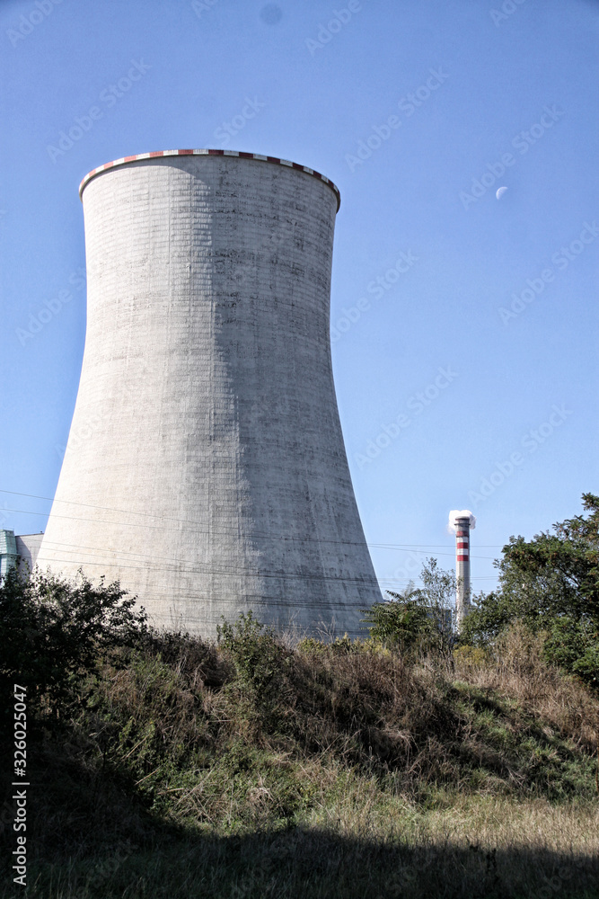 Tall concrete cooling tower of power plant