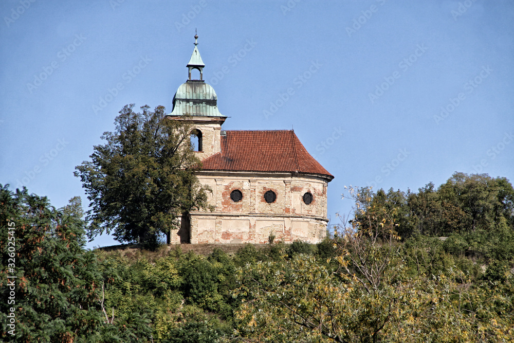 Small old church with single tower and red roof Small old church with single tower and red roof