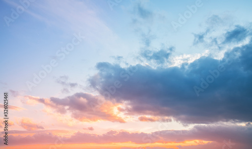 Beautiful bright sunset sky with clouds. Nature sky background. 