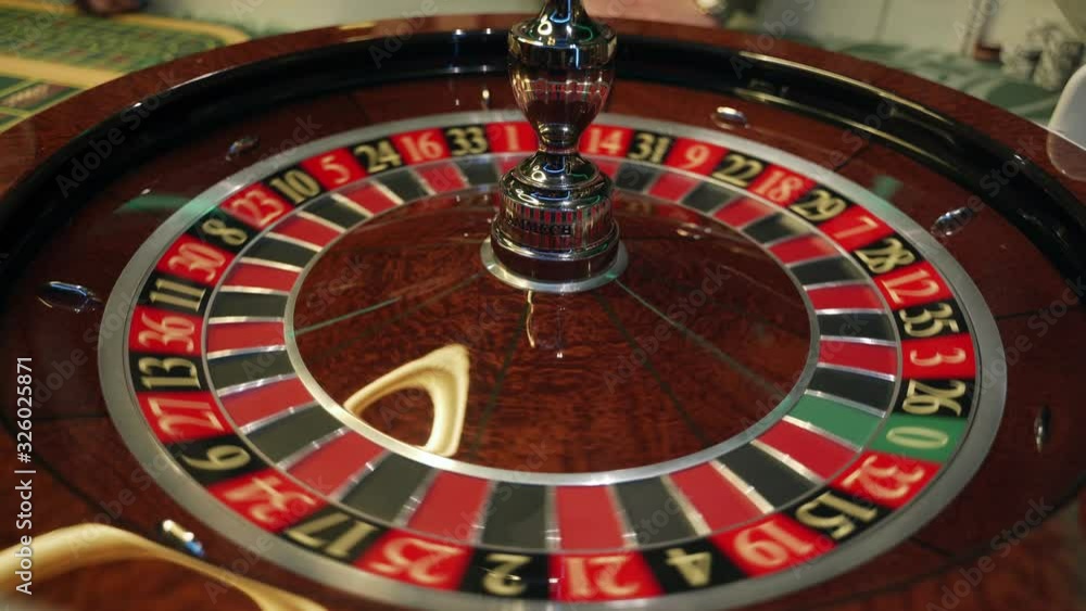 Сasino: roulette in Las Vegas with white ball. The ball falls on the field twenty three red. Top view. Close-up. 4K video Сasino: roulette in Las Vegas with white ball. The ball falls on the field twenty three red. Top view. Close-up. 4K video
