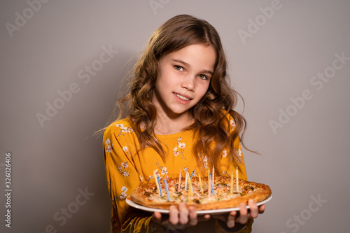 Obraz na plátně teen girl holding pizza with candles don't burn