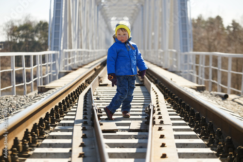 child is dangerous on the railroad tracks in spring