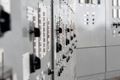 Industry. Regulation and control elements on the control cabinet. Close-up.
