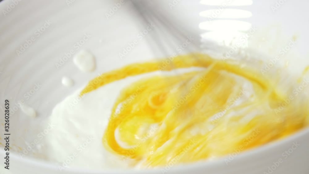 Mixing eggs with kefir - crepes dough making Mixing eggs with kefir - crepes dough making