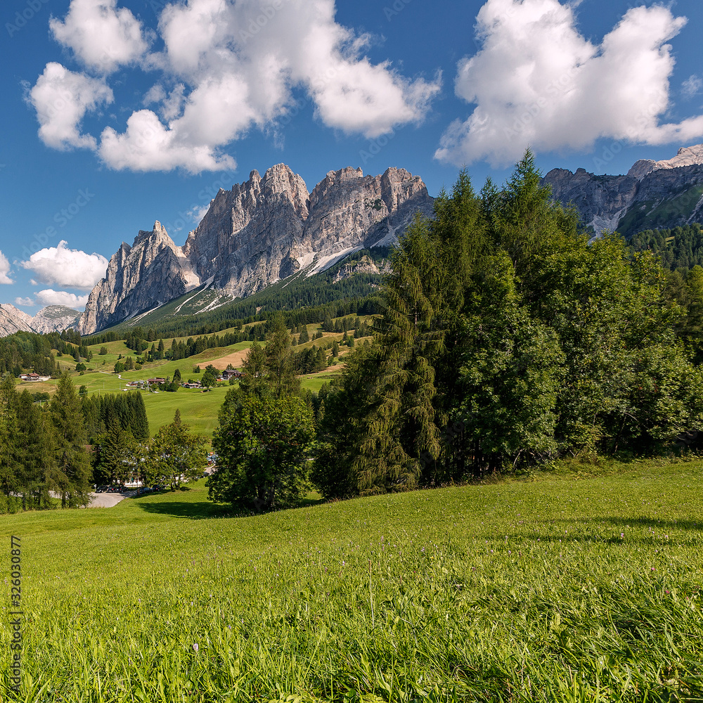 Wonderful sunny view on Dolomites Alps. Awesome alpine highlands in sunny day. Scenic image of fairy tale Landscape with perfect sky under sunlit, over the Majestic Rock Mountains. Wild area.